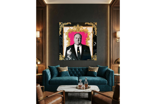 Luxury living room with a teal sofa, coffee table, and framed portrait on the wall.
