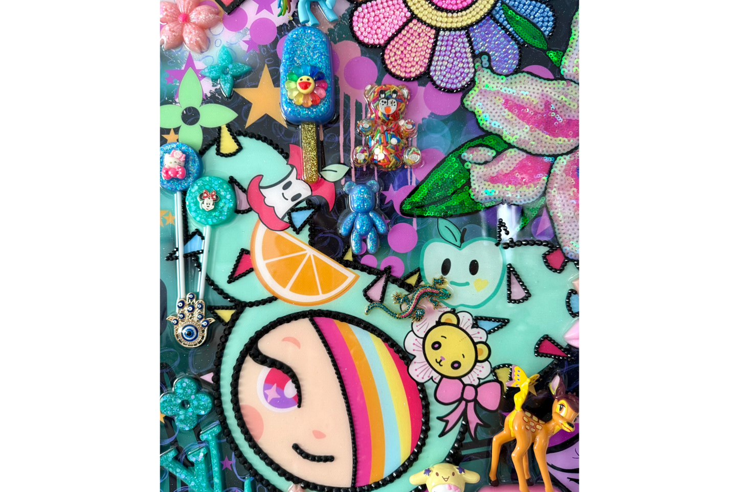 Colorful phone case with cartoon character and various decorative elements on a white background